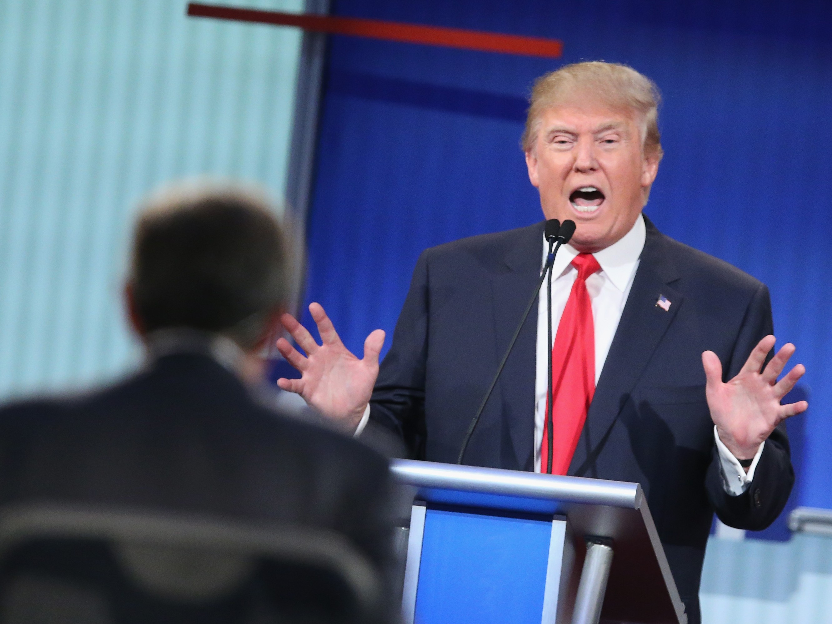 Donald Trump fields a question during the first Republican presidential debate hosted by Fox News and Facebook at the Quicken Loans Arena Thursday in Cleveland