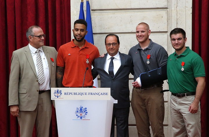 From the left British businessman Chris Norman Anthony Sadler a senior at Sacramento University in California French President Francois Hollande U.S. Airman Spencer Stone and Alek Skarlatos a U.S. National Guardsman from Roseburg Oregon pose at