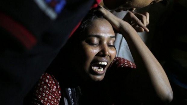 Ashamoni widow of slain blogger Niloy Chatterjee whose pen name was Niloy Neel cries at her house in Dhaka Bangladesh