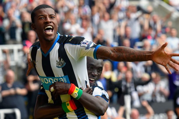 Georginio Wijnaldum of Newcastle United celebrates scoring their second goal with Papiss Cisse