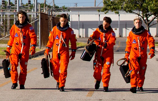 Going stratospheric One Direction's Drag Me Down sees the quartet taking off into space in their first video since Zayn Malik quit