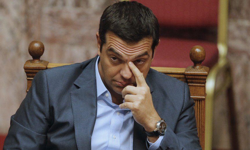 Greek Prime Minister Alexis Tsipras reacts as he attends a parliamentary session in Athens Greece