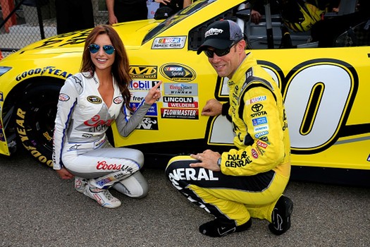 Matt Kenseth celebrates his pole with Miss Coors Light Amanda Mertz Friday at Michigan