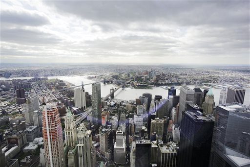 Financial District foreground the Brooklyn Bridge and East River center and in the distance Brooklyn as seen from the observatory at One World Trade Center. The Federal Reserve Bank of New Yor