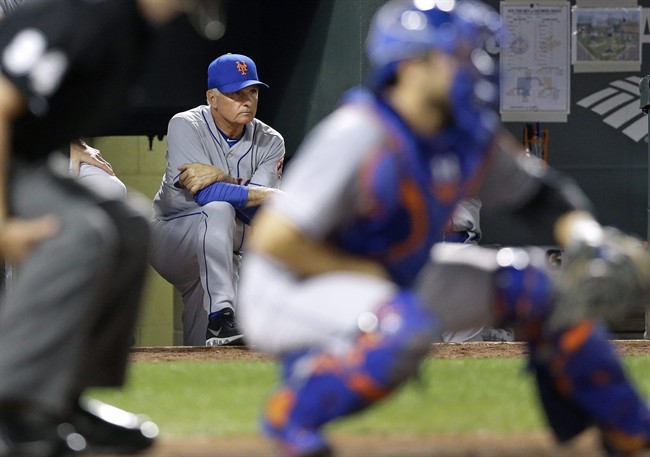 New York Mets manager Terry Collins back watches from the dugout in the fourth inning of a baseball game against the Baltimore Orioles Tuesday Aug. 18 2015 in Baltimore