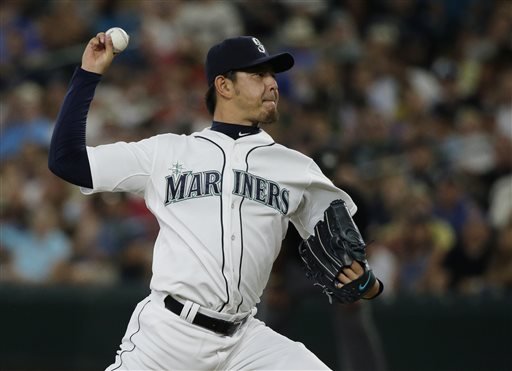 Seattle Mariners starting pitcher Hisashi Iwakuma throws to the Baltimore Orioles during the fifth inning of a baseball game Wednesday Aug. 12 2015 in Seattle