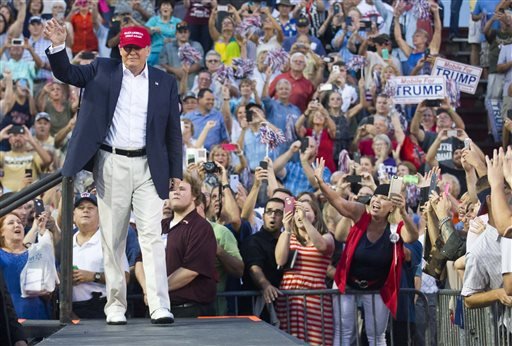 Republican presidential candidate Donald Trump waves to supporters during a campaign rally in Mobile Ala. on Friday Aug. 21 2015