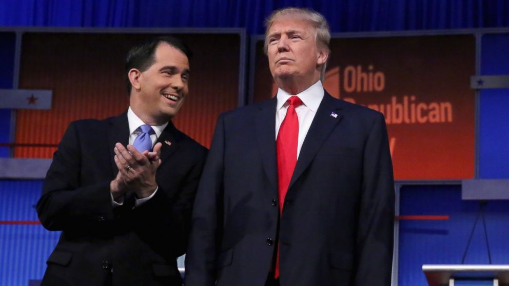 Wisconsin Gov. Scott Walker and Donald Trump take the stage for the first prime-time presidential debate hosted by FOX News and Facebook at the Quicken Loans Arena Aug. 6 2015 in Cleveland Ohio