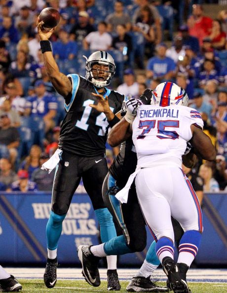 Carolina Panthers quarterback Joe Webb passes under pressure from Buffalo Bills linebacker Ikemefuna Enemkpali during the second half of an NFL preseason football game on Friday Aug. 14 2015 in Orchard Park N.Y