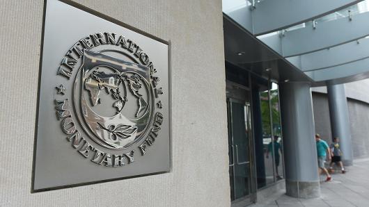 The seal of the International Monetary Fund is seen on a headquarters building in Washington DC