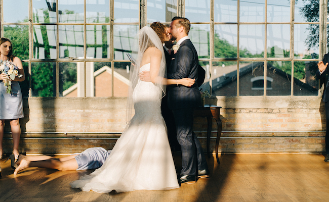 Bridesmaid collapses as newlyweds share first kiss