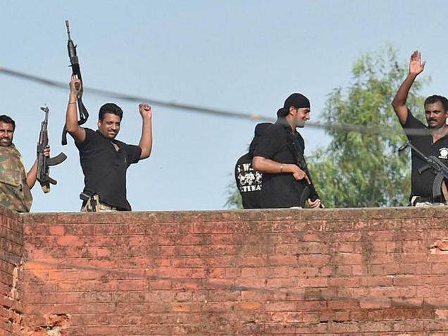 A Battle Won Security personnel celebrate after the completion of the 12-hour operation