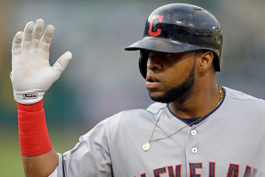 Cleveland Indians Carlos Santana celebrates after hitting a two run home run off Oakland Athletics pitcher Chris Bassitt in the first inning of a baseball game Thursday