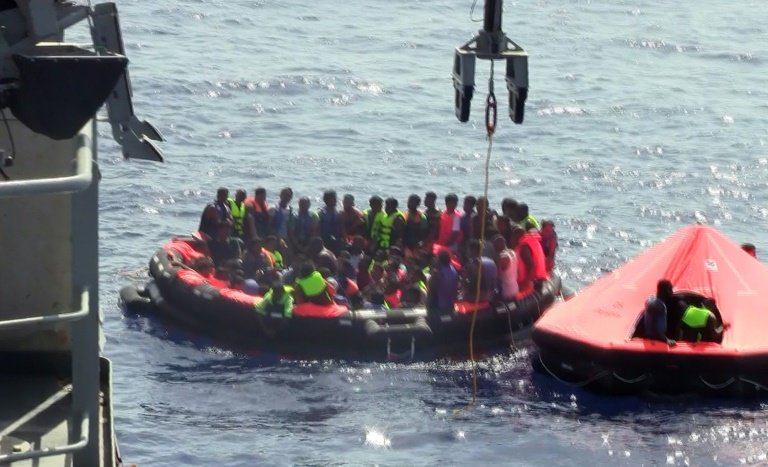 Migrants are rescued in life rafts launched from the Irish patrol vessel Niamh after their overcrowded fishing vessel capsized in the Mediterranean Sea off the coast of Libya