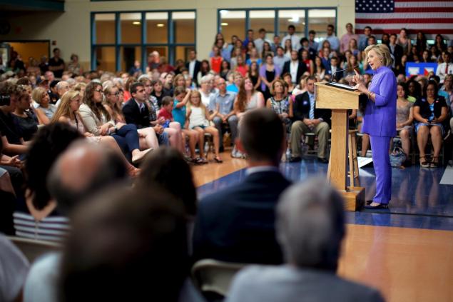 Hillary Clinton speaks at a campaign town hall meeting Monday in Exeter N.H. where she discussed her college affordability plan and afterwards answered questions about Donald Trump