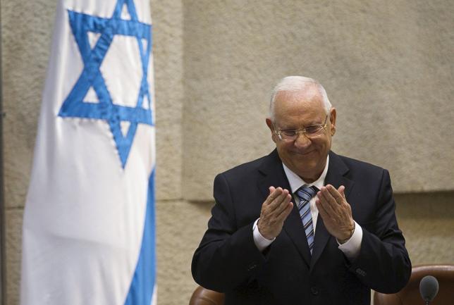 Israel's president Reuven Rivlin gestures during a swearing in ceremony at parliament in Jerusalem in this