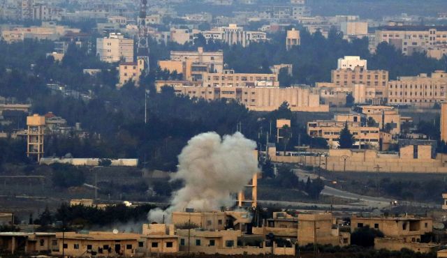 Smoke billows from buildings in Quneitra