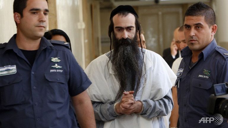 Israeli ultra-orthodox Yishai Shlissel brought handcuffed to the Jerusalem Magistrate's Court