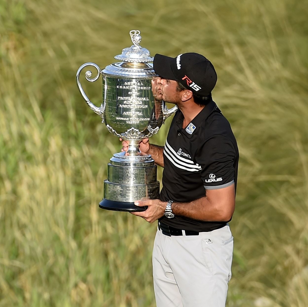 GOLF-6 Jason Day celebrates with the Wanamaker Trophy after winning the PGA Championship Sunday at Whistling Straits in Sheboygan Wis