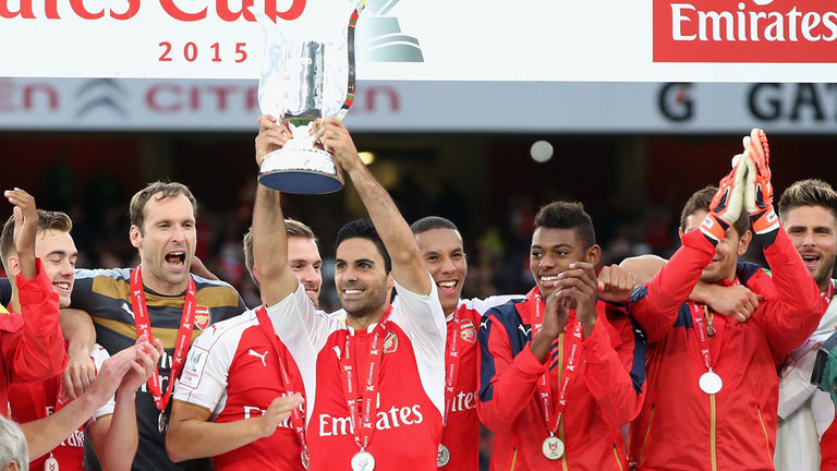 Mikel Arteta raises the Emirates Cup trophy after Arsenal's win over Wolfsburg