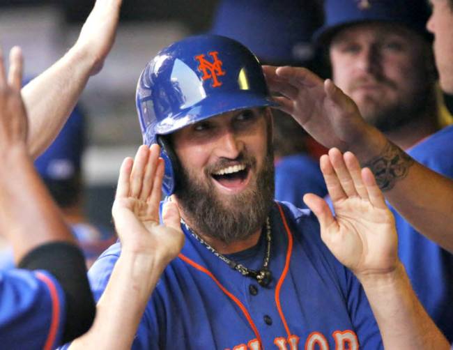 Mets&#39 Jon Niese is congratulated after he scored on a double by Curtis Granderson in the top of the third inning against the Colorado Rockies