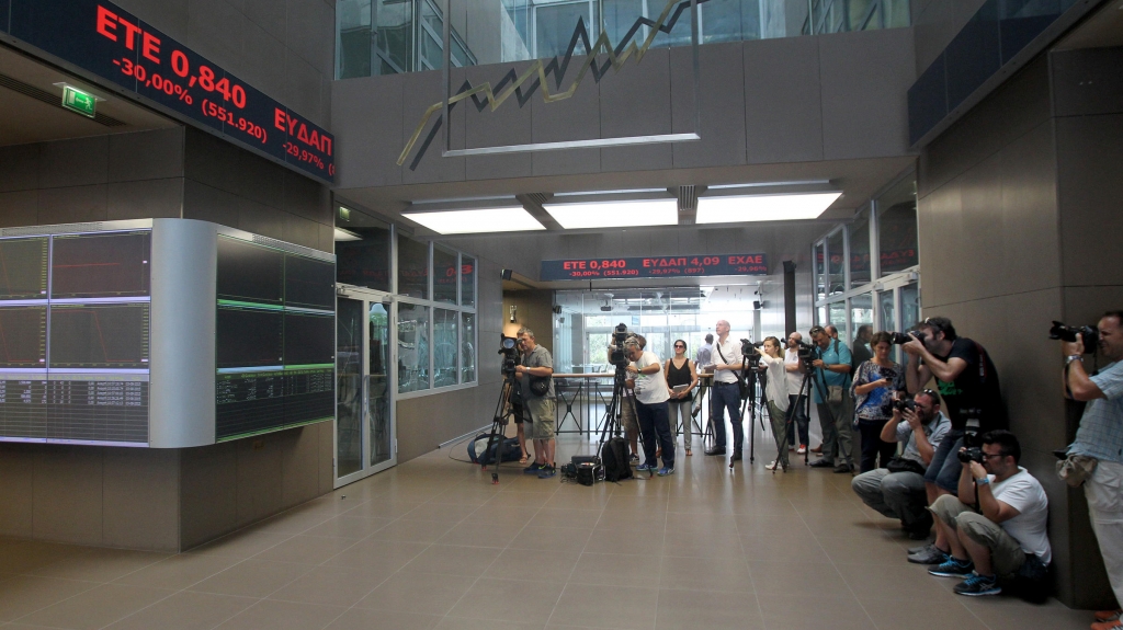 Journalists gather at Greece's Stock Exchange as it reopens on Monday Aug. 3 2015