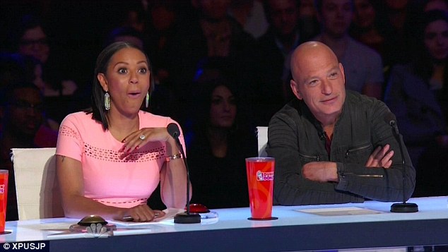 Judges Mel B and Howie Mandel watch contestants on America's Got Talent