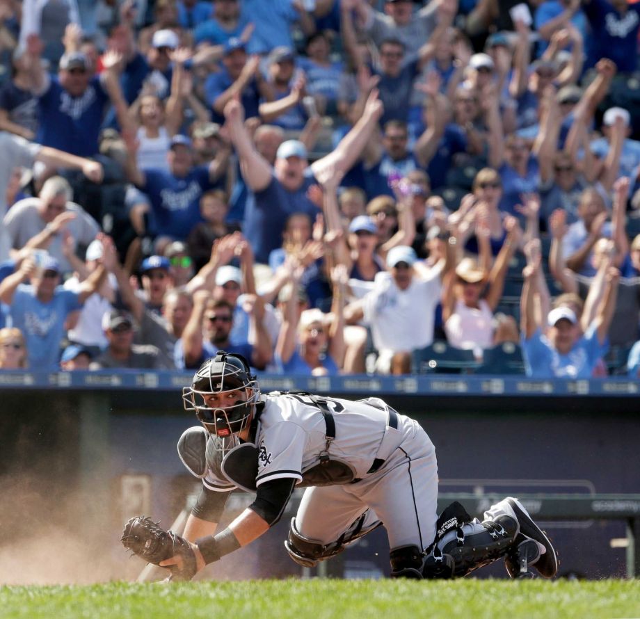 Chicago White Sox catcher Geovany Soto looks for the call after Kansas City Royals Alex Rios scored the go-ahead run on a fielder's choice hit into by Omar Infante during the eighth inning of a baseball game Sunday Aug. 9 2015 in Kansas City Mo. Phot