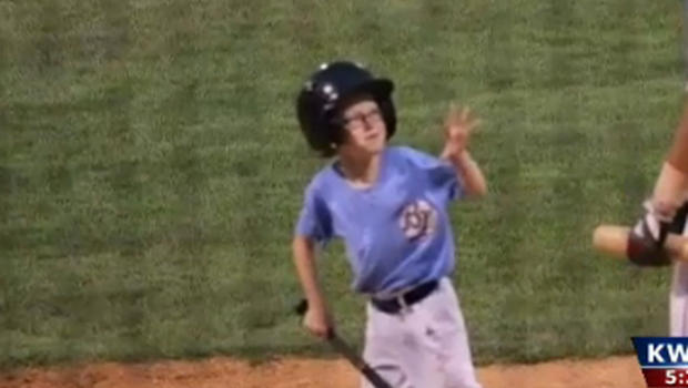 Kaiser
Carlile 9 in his role as bat boy for Liberal Blue Jays         
                                     KWCH-TV