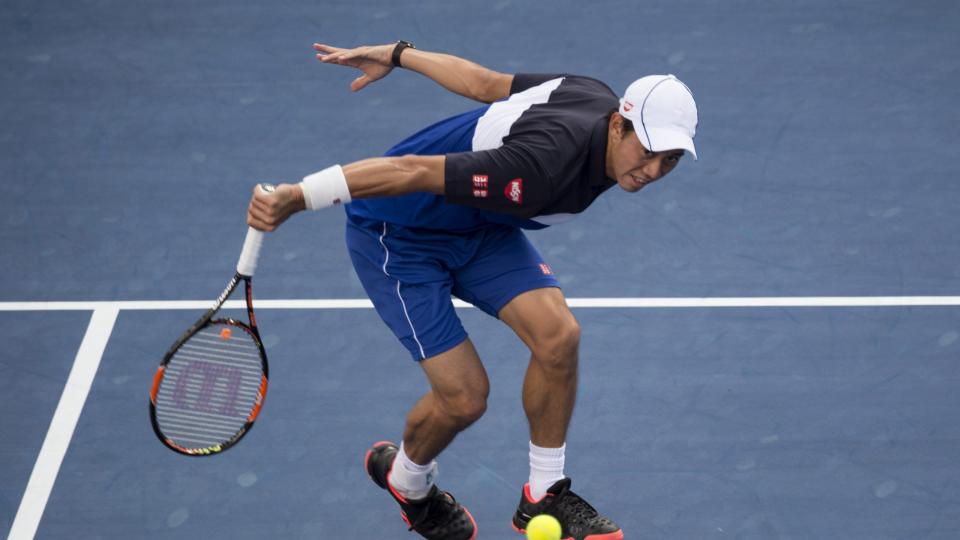 Kei Nishikori of Japan returns to Pablo Andujar of Spain at the Rogers Cup men's tennis tournament Wednesday Aug. 12 2015 in Montreal. MANDATORY CREDIT