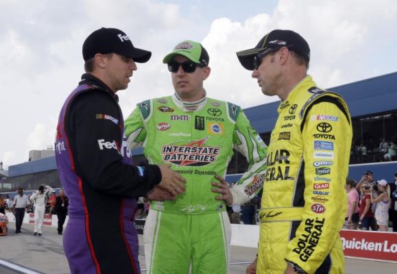 Denny Hamlin left talks with Kyle Busch center