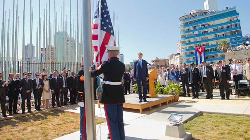 Secretary of State John Kerry and other dignitaries watch as U.S. Marines raise the U.S. flag over the newly reopened embassy in Havana Cuba. Friday Aug. 14 2015. AP