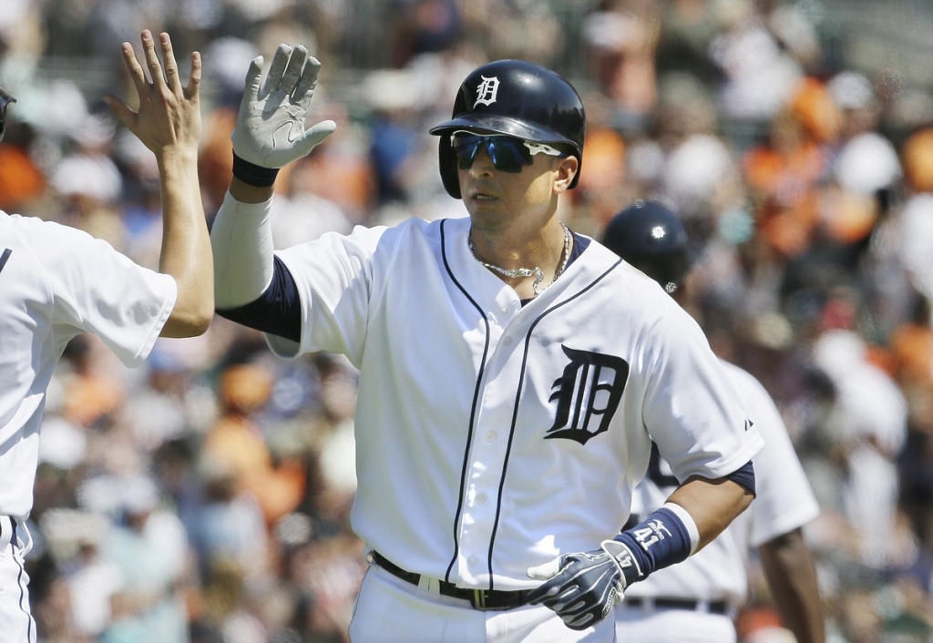 Detroit Tigers designated hitter Victor Martinez is high-fived after his two-run home run off Kansas City Royals starting pitcher Yordano Ventura during the fifth inning Thursday in Detroit