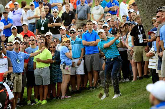 SLOWING DOWN Jordan Spieth plays his second shot on the third hole during the first round of the World Golf Championships Bridgestone Invitational at Firestone Country Club South Course on Friday in Akron Ohio. AFP