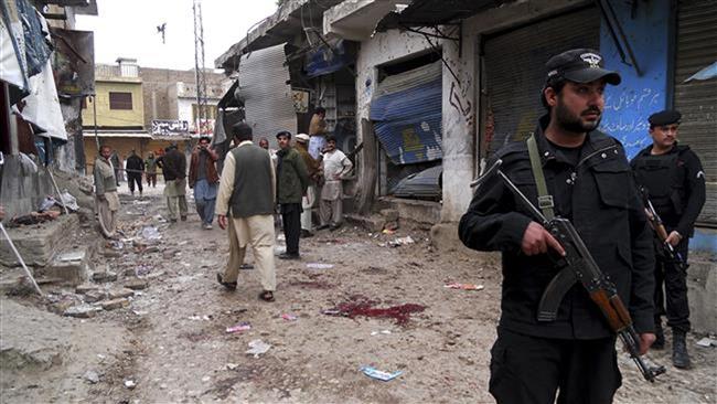 Police officers cordon off an area after a bomb attack in Hangu Khyber Pakhtunkhwa province of Pakistan