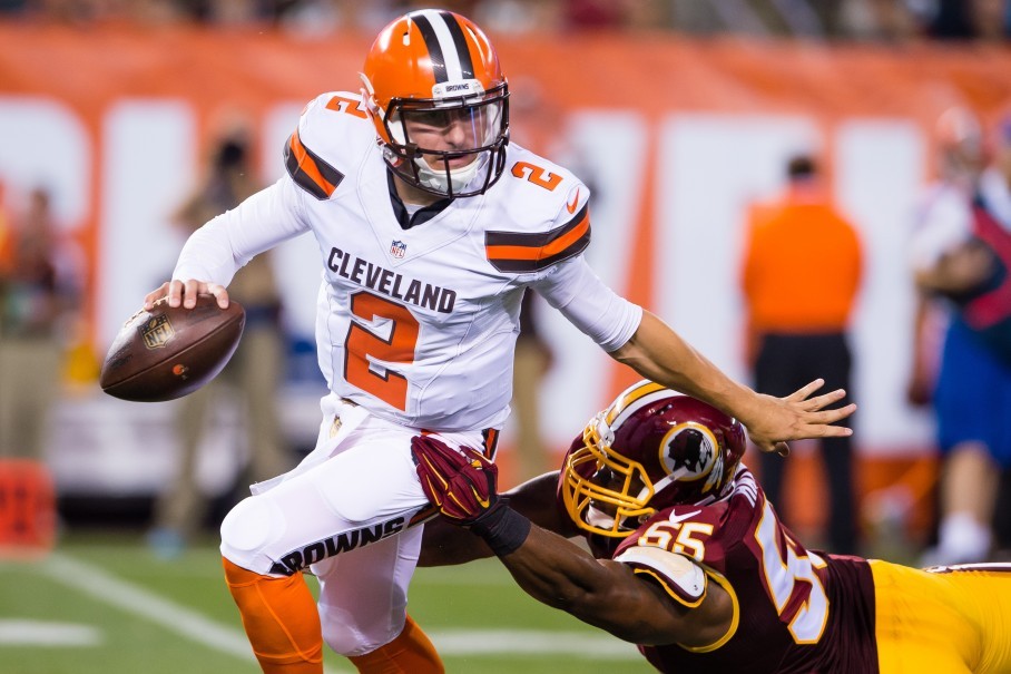 Linebacker Adam Hayward chases quarterback Johnny Manziel during Thursday’s preseason opener