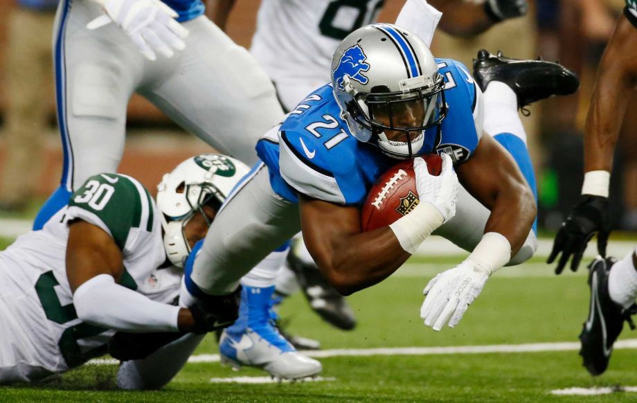 Detroit Lions running back Ameer Abdullah is stopped by New York Jets cornerback Darrin Walls during the first half of an NFL preseason football game Thursday Aug. 13 2015 in Detroit