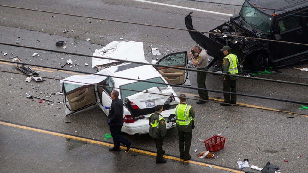 Los Angeles County Sheriff's deputies investigate the scene of a car crash where one person was killed Feb. 7 2015