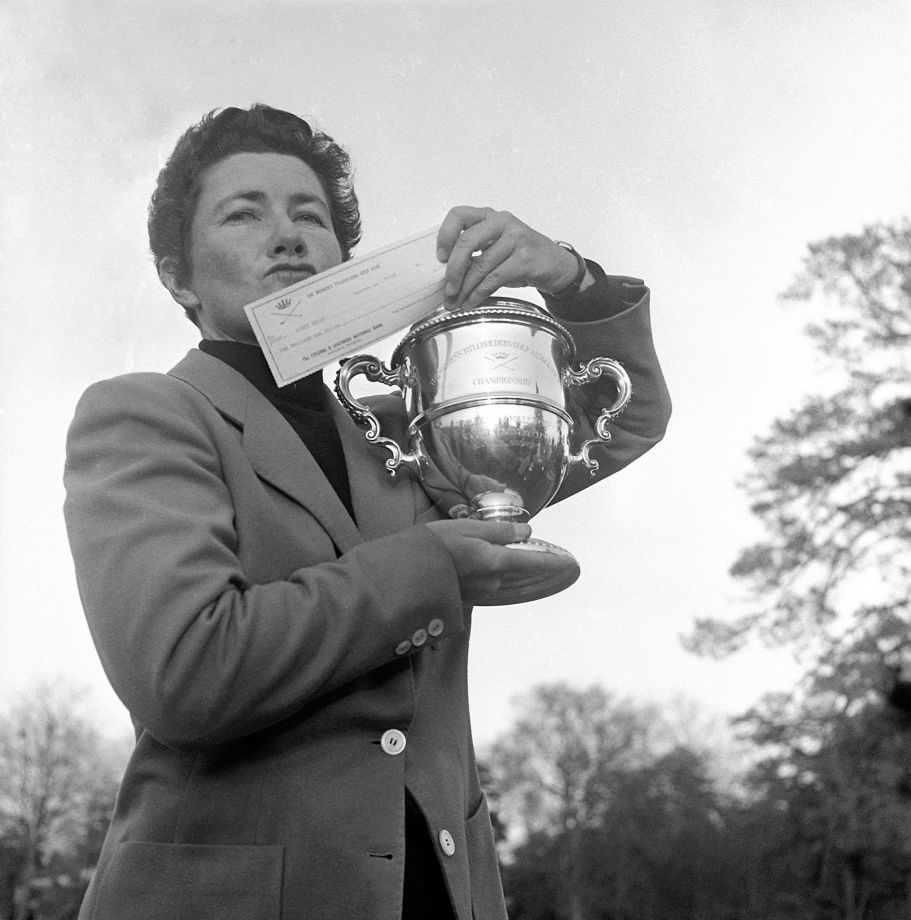 Louise Suggs is shown holding up a winner’s check in 1959