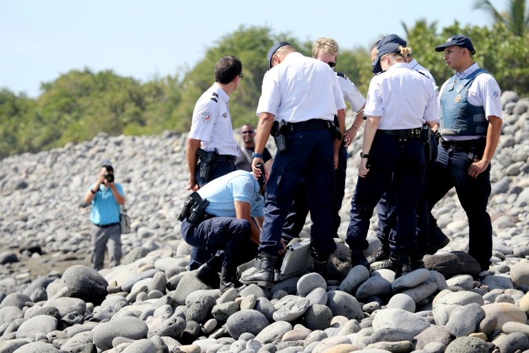 French and Malaysian experts will meet with police and magistrates in Paris to coordinate the investigation into Flight MH370 as a fevered hunt for more possible wreckage on La Reunion island