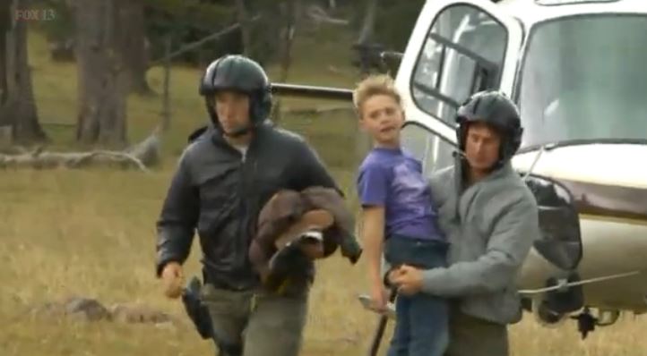 Malachi Bradley is carried off helicopter after being rescued from a Utah forest