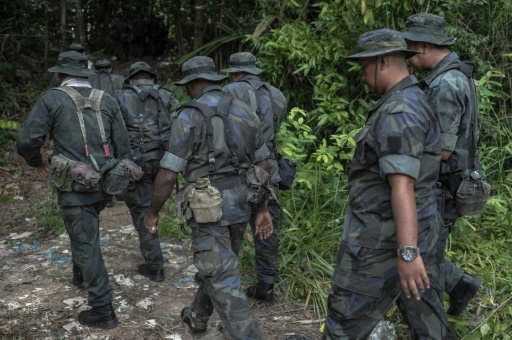 Malaysia finds more graves and human remains near Thai border