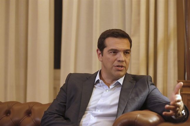 Greek Prime Minister Alexis Tsipras meets with Greek President Prokopis Pavlopoulos in Athens Thursday Aug. 20 2015. Tsipras announced his government’s resignation and called early elections Thursday seeking to consolidate his mandate to implement