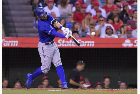 Toronto Blue Jays Kevin Pillar hits a ball that drove in two runs during the first inning against the Angels