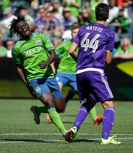 Seattle Sounders Obafemi Martins left reacts to a play as Orlando City's David Mateos looks on in the second half of an MLS soccer match Sunday Aug. 16 2015 in Seattle. The Sounders won 4-0