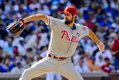 Philadelphia Phillies&apos starting pitcher Cole Hamels delivers during a baseball game against the Chicago Cubs in Chicago on Saturday