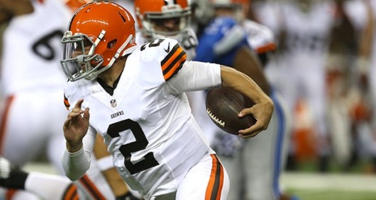 Cleveland Browns quarterback Johnny Manziel evades the Detroit Lions Kyle Van Noy during the second quarter in exhibtion action on Aug. 9 2014 at Ford Field in Detroit. Credit Courtesy of TNS