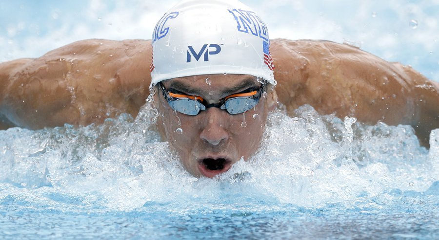 Michael Phelps competes in the preliminary round of the men's 100-meter butterfly at the the U.S. swimming nationals Saturday Aug. 8 2015 in San Antonio Texas