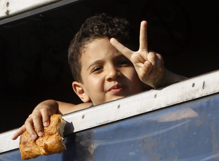 A young refugee embarks on a train trip toward Serbia from the southern Macedonian town of Gevgelija