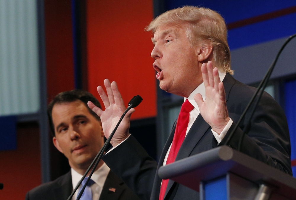 Republican presidential candidate Donald Trump speaks to the media in the spin room after the first Republican presidential debate in Cleveland